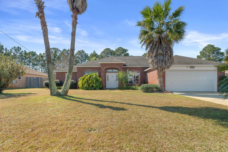 This home offers an open floor plan enhanced by high ceilings with tons of natural lighting near all amenities of life. The master suite has dual vanities, walk in closets and enough space to fit a king bed. The kitchen has an island perfect for cooking, refaced cabinets and connects perfectly with your kitchen bar. The back yard is fully fenced for pets and entertainment due to the generous size pool. The owner has pressure washed, replaced windows, steam cleaned the carpets, replaced light fixtures, professional painted the home and cleaned out the pool. This property has been meticulously taken care of minutes away from the beach.