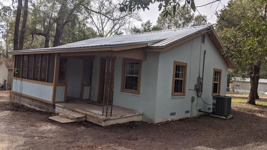 Looking to down size or just starting out or looking for a turn key rental property? Then look no further than this quaint Florida cottage home with a lot of upgrades. New Roof and Septic in 2016, New HVAC December 2019. Complete remodel of kitchen with new cabinets and beautiful butcher block counter tops and a tiled backsplash, all new appliances including a Refrigerator. New Wood laminate flooring through out the home and fresh paint and trim work. Bathroom has all new fixtures and a tiled bath. New water heater. Large lot with a huge back yard and the entire property is fenced. This home is affordably price and no work is needed, just move right in!