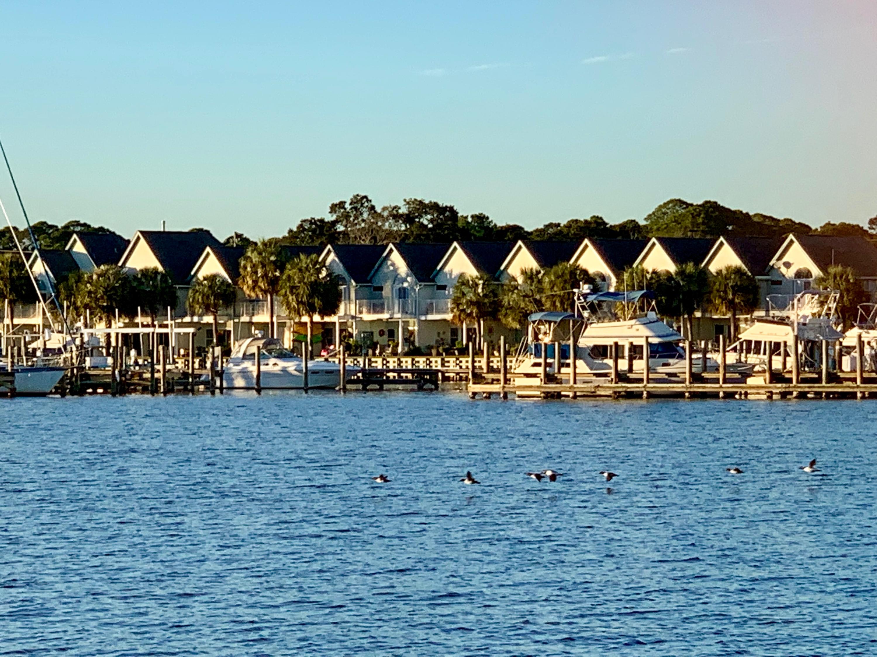 A unique, water-front townhouse tucked away in a gated community w/a 36 ft boat slip! Boat slip D20, with a quarterl Spacious living room, tile flooring and windows that span across the waterfront with incredible water views. Dining area is open to the living area making entertaining a breeze. Kitchen with lots of cabinets, counter space, and a breakfast bar. Large covered patio. Master bedroom has high vaulted ceilings + sliding glass doors that lead out to the balcony w/amazing water views. 36 ft. boat slip @ $382.96 per quarter. Access to 2 adjacent pools for a yearly fee of $ 200. Conveniently located near dining, shopping, military bases and the beaches. A short boat trip to Crab Island or enjoy the privacy of any of the secluded islands throughout Santa Rosa Sound