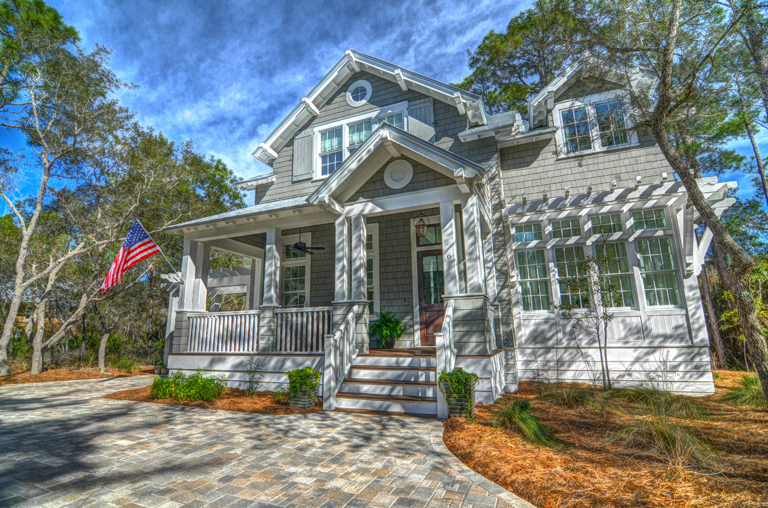 Located in the desirable Hammocks at Seagrove, a gated, nature inspired, coastal gem. Just steps away from Seaside and the beaches of the Gulf of Mexico. Custom designed by the owners with Paul Geary of TS Adams Studio Architects, Inc., this 3 bedroom, 3.5 bath beach cottage is located on a large corner lot with abundant Florida native landscaping allowing an easy 2 min walk to either of the 2 newly renovated community pools. Only best in class building materials were used to create this lifelong home. A few of the many details include 12 foot shiplapped walls and ceilings on the first floor and all vaulted bedroom ceilings, Custom inset cabinetry, Thermador/Kitchenaid Appliance package, all marble counters, Restoration Hardware/Aiden Gray lighting, Restoration Hardware faucets Jeldwen Aluminum Clad window package, oversized cart barn storage with ample driveway parking to include a front circular and side driveway with pergola. 