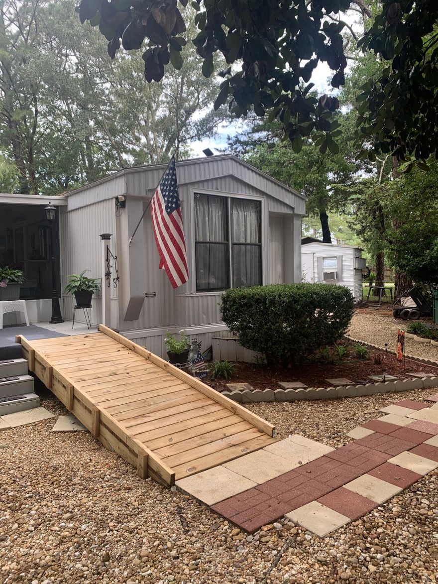 This is a fantastic little oasis in the heart of Ft Walton.  Once you enter you will see the work and care that has been taken to this property. First off the addition was added in 2001 with its own electrical box.  The AC/Heat pump was replaced in 2019.  Roof is 2010. Recently the well pump was added.  There are 7 rooms and 2 full baths.  The yard is fully fenced and there is one 1 yard building and a workshop that has ac and electrical. All structures including the yard buildings have been hurricane strapped . Carpet replaced in 2016.  Porches are also hurricane rated.  Most walls have been drywalled.  New toilets have been installed. Laundry is located in the master bedroom closet.  Owner just had ductwork replaced on the mobile home side.  No financing cash only.