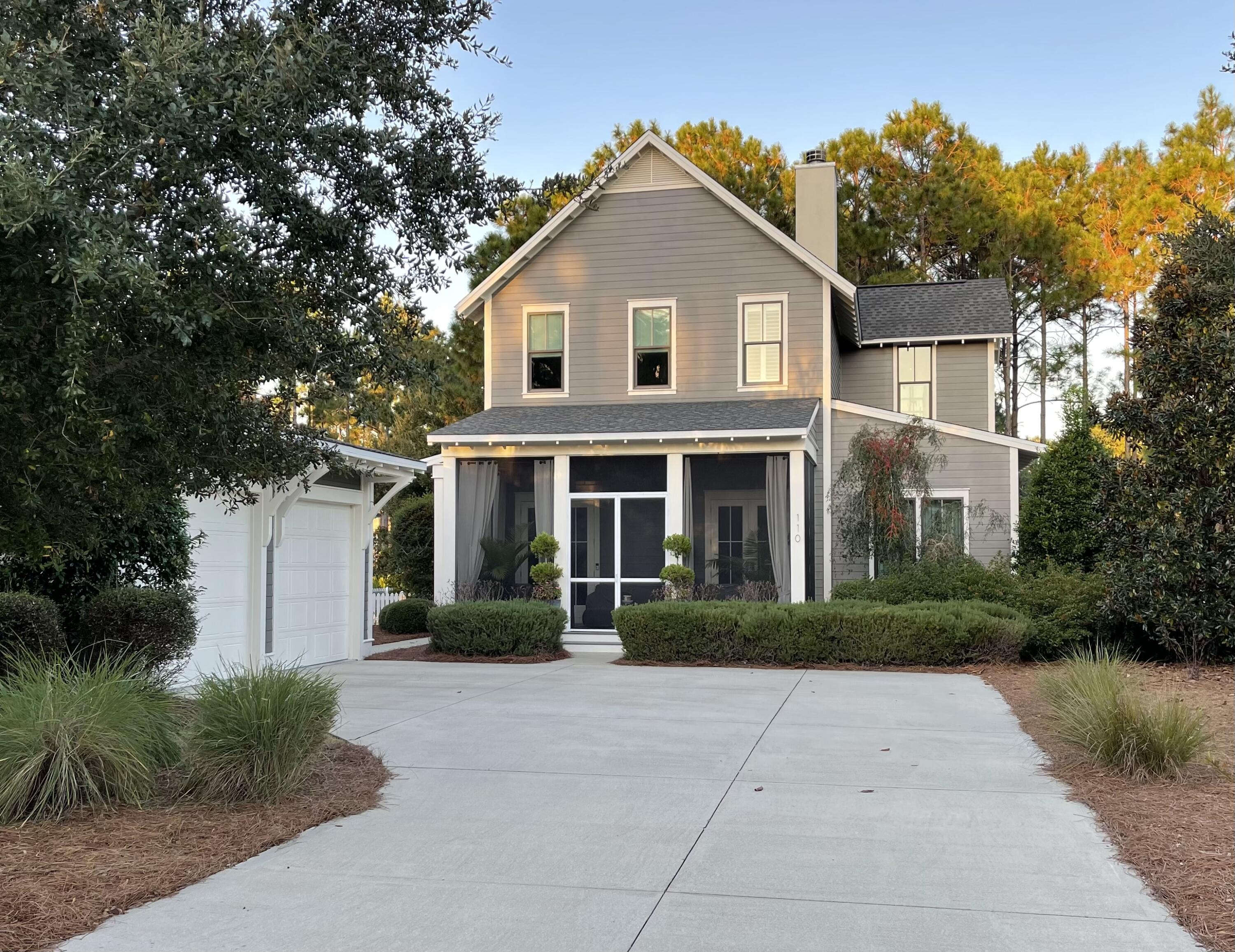Custom built home located on a large corner lot at the southeast corner of Wind Garden Park. This 4 bedroom and 4.5 bath home has 11 ft ceilings on the first floor and wood floors throughout. This home has plenty of kitchen cabinet storage with a butler's pantry. There is a large master suite on the first floor with a custom walk-in closet. The first floor has a see-through fireplace between the great room and dining room and screened-in porches in the front and back of the home. The second floor has another master bedroom and two guest bedrooms which have views of the park. This home has a generator, added landscaping, and an expanded driveway.