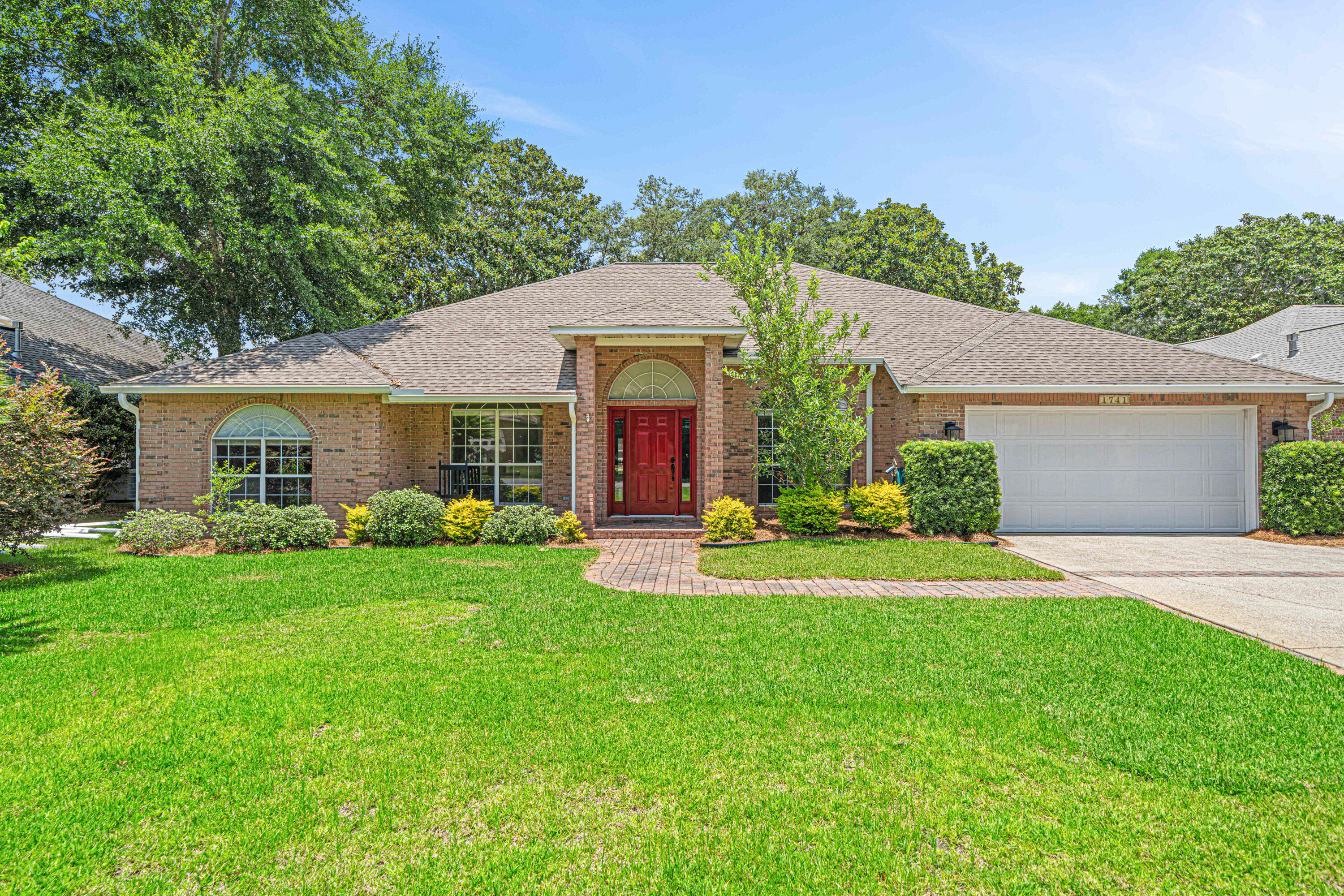 Welcome Home to this amazing all-brick Bluewater Bay home. Seated on a cul-de-sac, this home offers the perfect blend of luxury, comfort, and convenience for families of all ages.This single-story residence features 4 bedrooms and 3 full bathrooms with a versatile den/study that can serve as an optional 5th bedroom, plus a formal dining room. The home showcases Brazilian cherry wood flooring throughout the main living areas, kitchen, and master bedroom, complemented by high ceilings and crown molding that create an elegant atmosphere. The updated kitchen boasts granite countertops, stainless steel appliances, and a gas range, while the great room features a cozy gas fireplace. The home's large windows and skylights flood the interior with natural light, while the amazing kitchen provides abundant counter and cabinet space, including a convenient pantry.
This home features a gorgeous heated and airconditioned sunroom overlooking a large screened-in back porch and privacy-fenced backyard adorned with mature magnolia trees and stately oaks.
The large master suite has been well thought out and includes space for a sitting area. The luxurious master bath offers double vanities, a jacuzzi tub, and newly renovated walk-in shower, plus a spacious 10-foot closet.
Bedrooms 2 and 3 share a hall bath while the 4th bedroom and en-suite bath are fully renovated to accommodate wheelchair or walker with tile floors, zero entry shower and ADA vanity.
Custom closets by Artisan Closet System have been installed in every bedroom, maximizing storage throughout the home.
Walking distance to Bluewater Bay's exceptional amenities including pools, marina, and tennis center, with quick golf cart access to the championship golf course. The home is strategically located near walking, biking, and golf cart paths throughout the community.
Convenient location: short drive to Eglin and Duke Field, and just minutes from the sugar-white sand beaches of Destin.
All major systems recently updated including new roof in 2019, new tankless water heater 2019, and new HVAC in 2020.