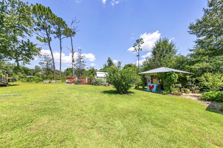 Charming 3BR/2BA Ranch on an Oversized Lot in the Heart of Freeport - No HOA! Neighboring parcel also for sale MLS listing 998290. Together, these 2 parcels equal 2 acres of prime commercial frontage along HWY 331. Discover the warmth and character of this beautifully maintained brick ranch situated on a spacious lot in a quiet, non-HOA neighborhood. Offering 3 bedrooms and 2 full bathrooms, this home blends vintage charm with thoughtful updates, creating a truly inviting and comfortable living space. Step inside to an eclectic, designer-inspired interior featuring updated flooring, fresh paint, and an abundance of natural light. The cozy living room is anchored by large windows and stylish finishes, creating the perfect gathering spot. The adjacent dining area flows effortlessly into the  open kitchen where modern appliances, and rustic accents add personality and function. The primary suite offers generous space and a bright, airy feel, while two additional bedrooms provide flexibility for guests, family, or a home office. Both bathrooms have been updated with clean, modern tilework and fresh fixtures. Outdoor living shines here - enjoy a charming covered front porch, mature landscaping, and a spacious screened-in patio that overlooks the spacious yard. An outdoor pavilion is perfect for backyard barbeques and entertaining and hosting friends. With plenty of room for gardening, entertaining, or future expansion, the oversized lot provides endless possibilities. Located just minutes from schools, parks, shopping, and the bay, this property delivers the freedom of no HOA plus the comfort of a well-loved home.