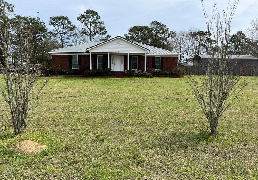 Remarks: Lovely brick home on large corner lot a little over an acre. Total under roof 2889 square feet with 1848 square feet heated and cooled. Three bedrooms split floor plan and two full baths. Master bath has 2 walk-in closets, double vanity and a separate shower. The additional bedrooms' have walk-in closets. Hardwood and LPV throughout the home. Spacious two car garage with loads of extra parking. The Fenced (privacy fence) backyard has a 20 x 40 covered RV parking space and an additional 18 x 20 carport space. Carport space has an enclosed 12 x 18 workshop on the back. Entrance to the back yard is a double gate to allow for large RV. The home had solar panels installed in 2022 with a Tesla whole home backup battery. A new AO Smith Voltex 60-gallon commercial grade water heater ins