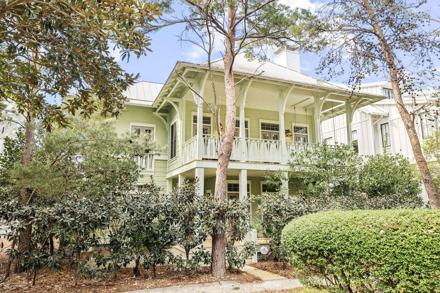 Steps from Western Lake within WaterColor's Phase 3 - the coveted 'Lake District' - 35 Rain Lily offers a rare combination of location, instant livability, and long-term upside in one of 30A's most desired communities. 

The 2,611 square-foot single-owner, never rented residence features three bedrooms, a bunk room, and a library/flex space currently in process for HOA-approved conversion to a fourth bedroom - all built on a reverse floor plan that places the main living experience on the second level to capture views of the surrounding tree canopy and the sights and sounds of two water features.

Tucked away from automobile traffic, the home is two lots from the Boathouse pedestrian bridge over Western Lake and the trail system which connects you to WaterColor's full amenity network: multiple pools, tennis and pickleball courts, fitness center, Camp Watercolor lazy river, nature trails, and a direct path with deeded access to the WaterColor Beach Club.

Reclaimed 126-year-old Heart of Pine hardwood floors carry through every room, lending warmth and continuity throughout. Upstairs, 20-foot vaulted ceilings open above a living room anchored by a fireplace, while the kitchen is outfitted for serious use: solid wood self-closing cabinetry, a large walk-in pantry, granite countertops, twin stainless steel dishwashers, dual sinks, a Wolf gas range, and a Sub-Zero refrigerator. The layout flows naturally into dining and outdoor spaces, making the home as functional as it is comfortable.

Outdoor living is the star here. The front balcony and patio both offer swinging daybeds overlooking green space and the trail system. At the back of the home, a large deck provides the footprint for expanded entertaining or Design Board tentatively approved additional bedrooms. A fully screened carriage house connects directly to the kitchen and dining spaces and converts easily into an additional private guest suite or full mother-in-law unit overlooking a private yard primed for a sizable pool -- rare in WaterColor at any price. Below, covered two-car parking and bike storage complete the structure.

Opportunities at this price point, with the flexibility for immediate use, personalization, or near doubling of existing square footage (deck buildout and carriage house suite) and a pool have largely disappeared from anywhere within WaterColor.