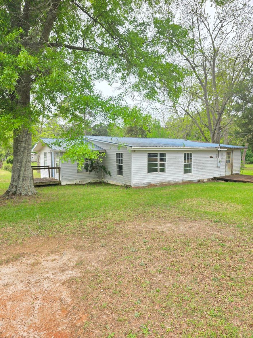 Investment Opportunity! This 3 bedroom 2 bath home needs to be renovated but priced with plenty of upside. Deep well. Paved road access. Great proximity. Cash only.