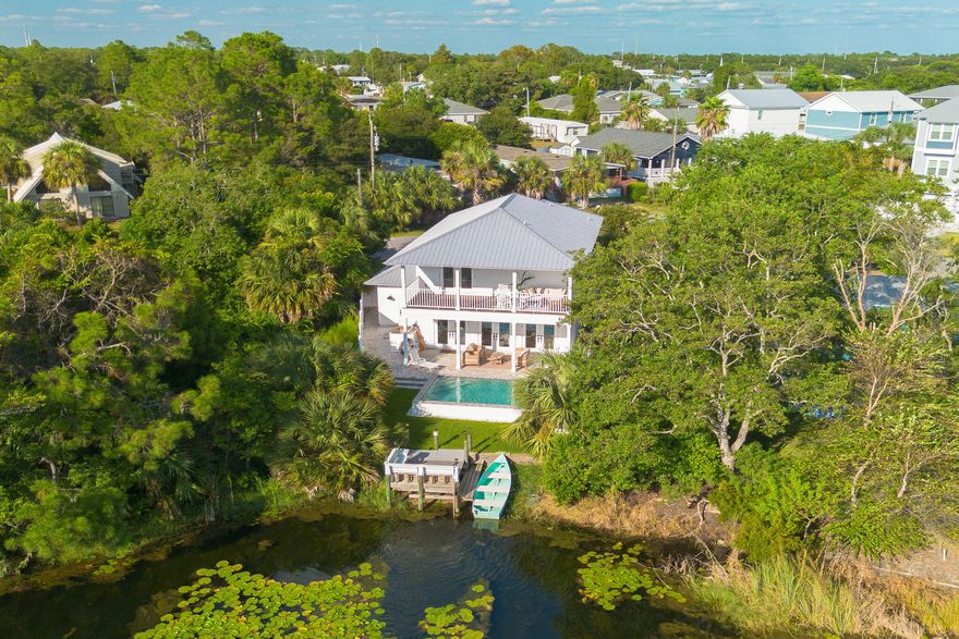 Step into luxury and relaxation at a newly renovated, two-story home in the tranquil Laguna Beach area of Panama City Beach, Florida. Just a short 2-minute walk from the stunning white sand beaches, this 4-bedroom, 3-bathroom home promises a memorable stay for families or groups of friends. Whether you're soaking up the sun by the brand-new private pool, exploring the freshwater lake from your dock, or enjoying the beauty of the Gulf's sunsets, this home offers everything you need for a perfect beach getaway. Location is everything, and this has it all. Located just two blocks from multiple public beach access points, your toes will be in the soft, sugar-white sand in no time! Spend your days lounging by the pool, hunting for seashells on the beach, or fishing from the dock!