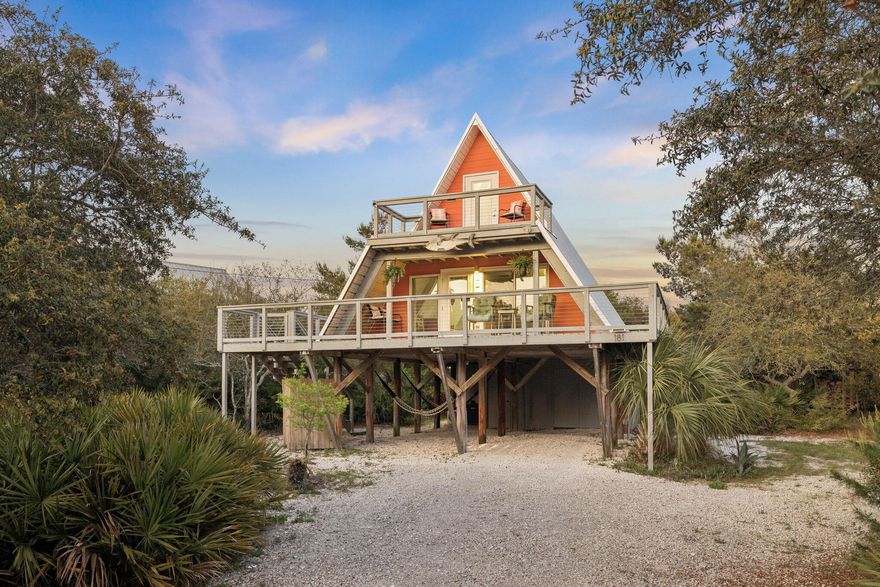 Tucked away on a generously sized homesite in the heart of Inlet Beach, this iconic Mid-Century Modern A-frame is a rare piece of Old Florida--one of only a handful of original beach homes remaining along 30A. Built in the early 1970s and held within the same family since its inception, the home carries a story and character that simply cannot be replicated.

Originally delivered as a steel-framed kit home designed to withstand coastal conditions, the structure has proven itself over decades with no history of hurricane damage. Today, it has been thoughtfully curated back to its surf shack roots--embracing its vintage soul while seamlessly incorporating modern systems and conveniences.

 Inside, original pine-paneled walls, a signature spiral staircase, and painted sand-toned floors create  a warm, nostalgic atmosphere. The home's personality shines through in every detail--from the preserved avocado Kenmore stove and original cabinetry to the carefully selected retro finishes and artwork. With 2 bedrooms, 1.5 baths, and an outdoor shower, the layout is simple, functional, and true to its coastal origins.

Outdoor living is equally compelling, with front and rear decks designed to capture both sunrise and sunset, as well as an upper-level balcony offering elevated western views. The surrounding grounds have been intentionally landscaped with native vegetation to create a private, relaxed setting rarely found this close to the beach.

Beyond its character, the home has been upgraded for modern living, including Hardie board siding, a newer metal roof, updated decking with stainless steel cable railings, an HVAC system with an upstairs mini split, water purification with pressure booster, and connection to county sewer. A hurricane fabric system provides an added layer of protection with ease of deployment.

The thoughtful floor-plan offers an open concept kitchen, dining and sitting area on the main level as well as a full suite bedroom and bathroom. On the second level a generously sized guest bedroom provides a private tranquil escape. This home is created for generations to create memories throughout the space. 

Positioned just steps from the sand and at the gateway to 30A, this location offers immediate access to Rosemary Beach, Alys Beach, and an endless array of dining and shopping options--all within walking distance.

Opportunities like this are increasingly rare--a true legacy property offering scale, privacy, and irreplaceable character in one of the most sought-after coastal markets in the country."