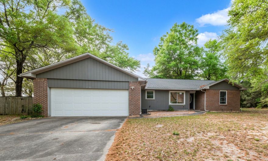 Beautiful split-bedroom home situated on a desirable corner lot on a quiet street that ends in a cul-de-sac in Niceville. This well-maintained property features a spacious, open layout perfect for both everyday living and entertaining.

The large kitchen is a standout with granite countertops, mosaic tile backsplash, gas range, oversized refrigerator, dishwasher, and microwave. A versatile breakfast bar doubles as a buffet area and flows seamlessly into the dining space--ideal for hosting gatherings.

The living room boasts a vaulted, beamed ceiling, cozy gas fireplace, durable laminate flooring, and French doors that open to a fantastic patio--perfect for outdoor entertaining. The private primary suite also features a vaulted, beamed ceiling and a generous walk-in closet. The updated en-suite bath includes a large soaking tub, separate tiled walk-in shower, and double vanity.

Enjoy the expansive, fully fenced backyard with a 6-foot privacy fence, offering plenty of space for outdoor activities. Additional storage is available in the garage attic.

This home combines comfort, style, and functionality in a great location--don't miss it!