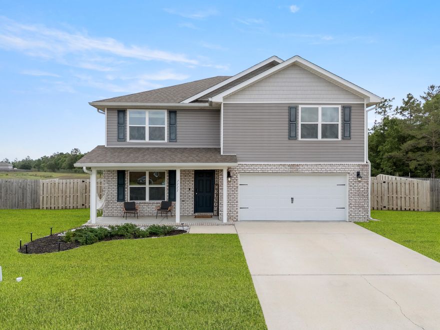 Tucked away on a quiet cul-de-sac in Redstone Commons, 1111 Capocci Court is the kind of home that immediately feels welcoming the moment you pull into the driveway. Sitting on an oversized quarter acre lot and within walking distance to Riverside Elementary and Shoal River Middle School, this home offers the space, flexibility, and layout that growing families are always searching for.

Step through the front door and you're greeted by a bonus flex space that could easily become your home office, kids' playroom, reading room, workout space, or even a potential sixth bedroom. Whether you work from home, homeschool, or simply want extra room to spread out, this space gives you options from day one.

As you move into the main living area, the home opens up beautifully with a bright, open concept design centered around the kitchen. Picture family gatherings around the oversized granite island, conversations flowing from the kitchen to the living room, and weekends spent entertaining friends while dinner cooks in the background. White cabinetry, stainless steel appliances, recessed lighting, and dark wood-look flooring give the downstairs a clean and modern feel without losing warmth.

Downstairs also features a full bedroom and bathroom, creating the perfect setup for guests, visiting family members, or a private retreat for someone who prefers not to deal with stairs.

Upstairs is where the home truly begins to unfold. At the top of the stairs, the oversized loft creates an entirely second living space perfect for movie nights, a gaming area, home gym, or a dedicated spot for the kids to take over. The additional bedrooms are generously sized with large closets, while the primary suite offers the kind of space you'll appreciate at the end of a long day with its oversized walk-in closet, double vanity, and spacious walk-in shower.

Out back is where this home really separates itself. The fully fenced backyard feels built for Florida evenings, complete with a beautifully designed paver patio, built-in fire pit, and custom stone bench seating. It's easy to picture cool nights around the fire, weekend cookouts, kids playing in the yard, and quiet mornings with coffee before the day begins.

With over 2,600 square feet, multiple flex spaces, a highly functional layout, and a cul-de-sac location, this home gives you the room to grow while still feeling comfortable, connected, and inviting from the moment you walk inside.