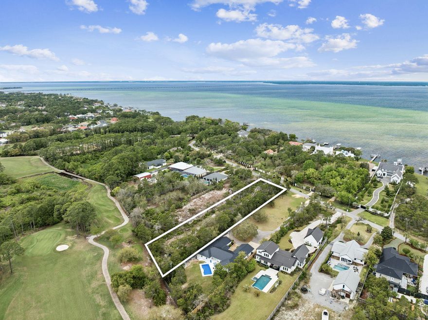 Rare opportunity to own an oversized 1.101-acre interior lot on Walton Way in the heart of Miramar Beach. This uniquely deep homesite, measuring approximately 479 feet, offers exceptional build potential for a private estate, second home, or investment property. The rear of the property backs directly to the Emerald Bay Golf Club, providing a peaceful setting with manicured green views and added privacy. With no HOA restrictions, buyers have the flexibility to design and build without the limitations often found in nearby communities. Ideally located just minutes from the Miramar Regional Public Beach Access and close to popular destinations including Pompano Joe's, Captain Dave's On the Gulf, and shopping at Silver Sands Premium Outlets and Destin Commons, this property combines space, location, and lifestyle in one of the most desirable areas along the Emerald Coast.