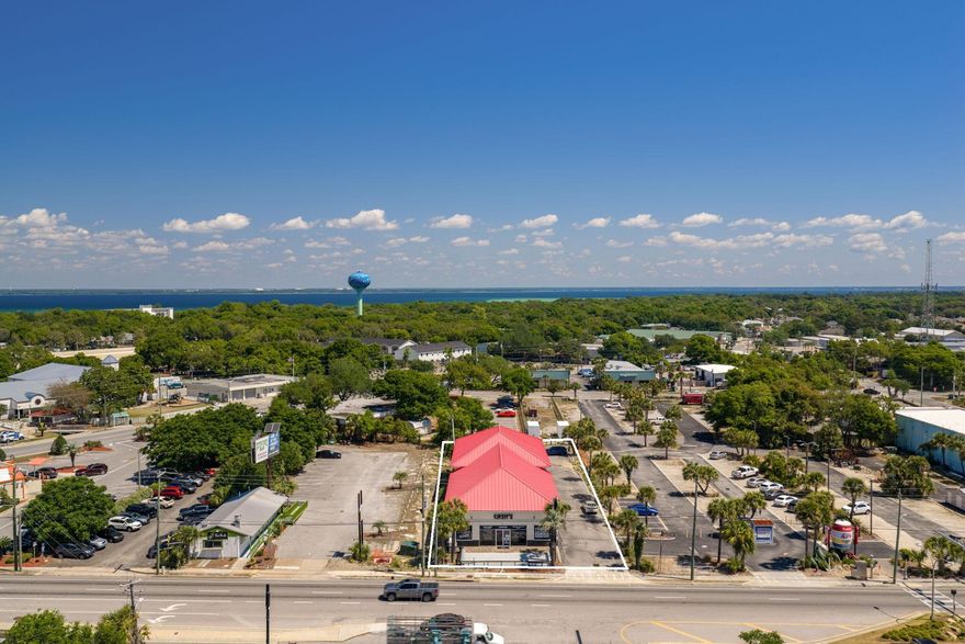 Located directly on Highway 98 in the heart of Destin's primary commercial corridor, this property offers exceptional visibility, strong traffic counts, and rare frontage in one of the most supply-constrained retail markets along the Emerald Coast. With a daily traffic count of 55,000 vehicles, the site delivers continuous exposure to both local residents and the millions of visitors who travel through Destin each year. The property totals 5,100 SF and is available For Lease at $32 per SF NNN, positioned for retail-only users seeking a high-impact location with immediate access and prominent signage. 
 An additional the back half of this property is also available for lease separately, at $25 per SF NNN-2,400 SF. Offering flexibility for operators who need secondary retail space, storage, or a complementary use. Both spaces are retail-only, and owner financing is available, creating an attractive entry point for tenants or investors looking to secure a foothold in Destin's thriving commercial landscape.

With its prime location, heavy traffic flow, and limited availability of comparable retail frontage, this property represents a standout opportunity for businesses seeking maximum visibility and long-term positioning along Destin's busiest corridor.