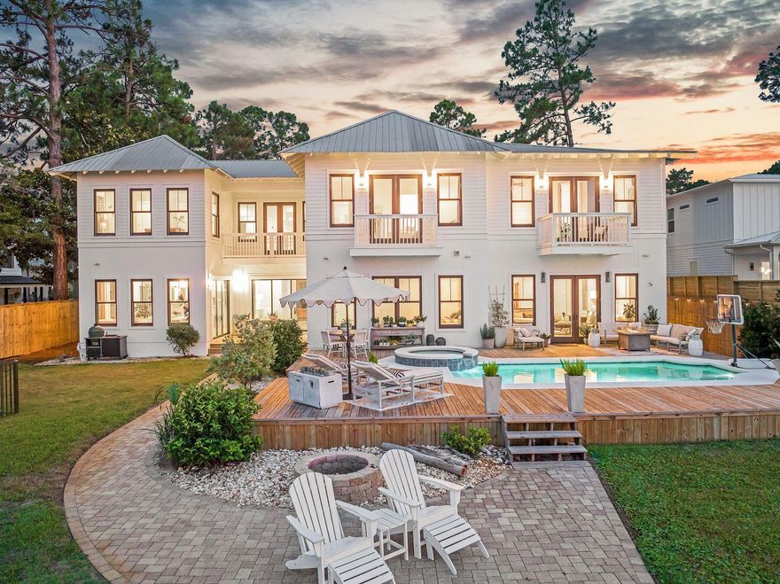 Priced below February appraisal of $4.6M and boasting a bonus depreciation estimate of over $740,000, this home is perfectly positioned along the serene shores of Choctawhatchee Bay, this exceptional Santa Rosa Beach estate offers a rare blend of luxury, privacy, and waterfront living. Set on more than half an acre with 100 feet of pristine bay frontage, the property presents sweeping water views, private bay access, and thoughtfully designed spaces ideal for both entertaining and everyday relaxation. Located just minutes from Scenic Highway 30A, residents enjoy quick access to world-renowned beaches, gourmet dining, boutique shopping, and lively cultural experiences.

The main residence spans approximately 6,300 square feet, boasting five bedrooms and 5.5 baths. A soaring double-height foyer welcomes you with unobstructed bay views, leading into an open-concept living area that seamless connects indoor and outdoor spaces. The chef's kitchen is outfitted with custom cabinetry, professional-grade appliances, and floor-to-ceiling windows that flood the space with natural light and capture breathtaking waterfront vistas.

Perfect for entertaining, the expansive living and dining areas open to a resort-style outdoor retreat featuring a heated pool, spa, and oversized sun deck. Whether hosting sunset soirées or enjoying peaceful mornings by the water, this outdoor oasis delivers the ultimate coastal lifestyle.

Upstairs, the grand primary suite is a tranquil escape, complete with floor-to-ceiling windows overlooking the bay, a luxurious spa-inspired ensuite with dual vanities, a walk-in shower, and a private water closet. Additional guest suites, a theater room with a wet bar, and an upstairs bonus space ensure comfort, entertainment, and privacy for all.

The detached carriage house provides 1,500 square feet of additional living space, featuring two bedrooms, 1.5 bathrooms, a full kitchen, and an open living and dining area. Ideal for guests or extended family, this beautifully appointed space features a private, wraparound porch with water views and its own entrance, accessible via an interior staircase.

For boating enthusiasts, the property features a private dock with a boat lift, a Jon boat/kayak launch, and a seawall, offering effortless access to open-water adventures. boasting a large boat house that is 38' wide and 32' long, capable of accommodating your favorite boat

Offering the perfect blend of elegance, function, and lifestyle, this bayfront estate is a true coastal sanctuary, moments from 30A, yet worlds away.