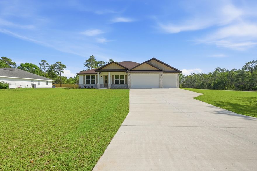 Fall in love with this NEW Craftsman style home in sought after, Holley-By-The-Sea! Located on an OVERSIZED PRIVATE CORNER lot, there is plenty of room to create the backyard space of your dreams with a future POOL, WORKSHOP and store your RV/BOAT with side yard access! 5-bedrooms, 3-bathrooms, & a HUGE 3-car garage plus all of the CUSTOM home upgrades that you have been looking for: BRICK exterior with 2X6 construction, TALL ceilings, 8' entry door, OVERSIZED 6' front windows, and a rear covered PATIO with a ceiling fan and recessed lighting. Inside boasts durable LVT flooring (no carpet), custom all-wood CEILING height cabinetry w/ soft-close hinges, WOOD HOOD vent cabinet w/ blower, tile backsplash, large kitchen ISLAND w/ double sided cabinetry, QUARTZ counters, MICROWAVE DRAWER, slide-in range, walk-in pantry, MUDROOM, and a laundry room with added FREEZER space. 
Other features include: recessed lighting throughout interior and exterior, coat closet, trey ceilings in living room and master bedroom, ceilings fans in all bedrooms and on back patio, jack and jill bathroom with double vanity and private water closet, 3rd full bathroom with back patio access, oversized closets with lighting, 2 walk-in closets in master suite, tiled walk-in shower with glass doors, private water closet, double vanity, linen closet, floating shelving, and an oversized window. Ask about Builder provided incentives!