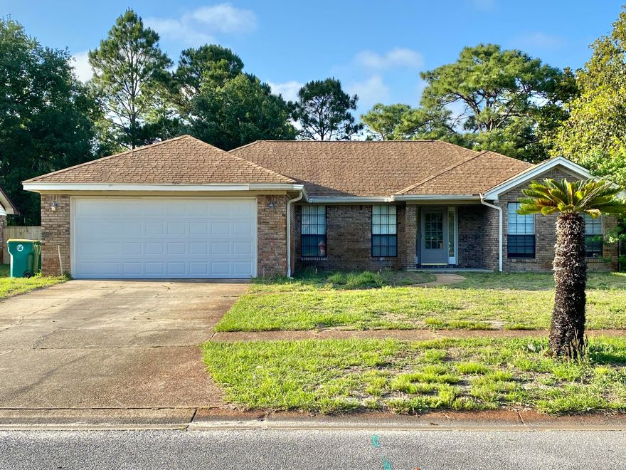 Welcome home! This lovely brick home is close to bases, beaches, shopping, and more. Enjoy your quiet retreat at this home that backs up to the base while sitting in your own Florida room. This well-maintained home features a kitchen island with a breakfast bar for getting ready for your day or just relaxing with friends. Freshly painted! Enjoy the fireplace, the spacious bedrooms, skylight, new fixtures, fully fenced backyard, and more. Ready for you to move in now! Buyer and Buyers agent to verify all dimensions and anything deemed important. Lawn Maintenance coming soon!