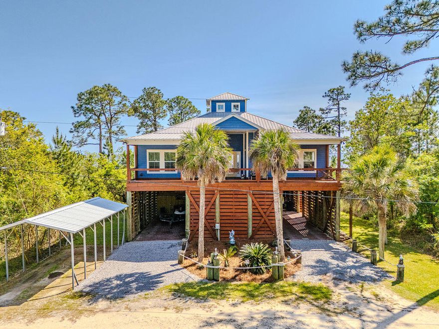 Waterfront, turnkey and made for easy Florida living.  This 3-bedroom bay front home with guest quarters blends coastal charm with a great entertaining space and big water views from every room. 

Custom built bay front home on pilings with private dock, covered boathouse, and a boardwalk to the Choctawhatchee Bay.

Open concept main level with vaulted tongue and groove ceilings, rich wood floors and walls of windows overlooking the bay.

The gourmet kitchen features granite countertops, large center island, breakfast bar, and stainless-steel appliances, all open to the dining and living areas for effortless entertaining. 

Spacious decks on the front and back that run the length of the home, offers plenty of room for dining, lounging and soaking in panoramic views.  Don't miss this gem!!