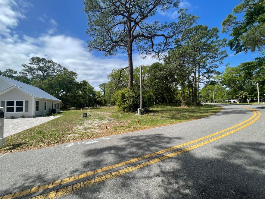This buildable 60x100 residential lot offers a rare opportunity to create your own coastal retreat. The neighborhood is undergoing an exciting revitalization, with newly constructed homes blending seamlessly with the area's rich maritime history. Just a short golf cart ride away, downtown Apalachicola awaits with its historic architecture, vibrant shops, and waterfront dining. Nearby boat ramps for easy deep water access. Two hour drive from two major airports. Just across the bridges from St. George Island's white sand beaches. Whether you're envisioning a forever home or a weekend getaway, this property checks all of the boxes. City of Apalachicola has verified the property has water and power present.