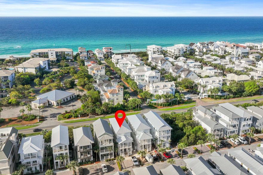 Tucked within the sought-after Seacrest Beach community along scenic 30A, this beautifully crafted new construction home delivers an effortless blend of upscale design and easygoing coastal charm--and it's offered fully furnished. With five spacious bedrooms and four and a half baths, the home showcases wide-plank engineered wood flooring throughout, creating a warm, cohesive feel across every level. Thoughtfully designed for both privacy and togetherness, the floor plan features two primary suites--one on the first floor and another on the top level--making it ideal for hosting guests or accommodating multi-generational living. Three separate living areas provide plenty of room to spread out, whether gathering as a group or enjoying quiet downtime. The first-floor living space anchors the home with a striking 72-inch electric fireplace that adds a contemporary touch and inviting ambiance. Upstairs, the second level offers an additional lounge area that flows seamlessly onto a covered porch, perfect for catching coastal breezes or entertaining with ease. The kitchen is both functional and stylish, featuring shaker-style cabinetry, quartz surfaces, a designer tile backsplash, and high-end appliances suited for everyday living or special occasions. Nearby, a well-appointed wet bar--complete with open shelving, a wine fridge, and an ice maker--enhances the home's entertaining appeal.

The third floor presents yet another living space along with an expansive balcony featuring a summer kitchen and beautiful Gulf views, creating an ideal setting for sunset gatherings or relaxed evenings overlooking Scenic 30A.

Modern conveniences include a Rinnai tankless water heater for endless hot water, as well as an in-home washer and dryer for added ease.

Residents of Seacrest Beach enjoy access to a convenient community shuttle, making trips to the Gulf's sugar-white sands simple and stress-free. Beyond the beach, you're just moments from the charming towns of Rosemary Beach and Alys Beach, where boutique shopping, dining, and local favorites await. Outdoor recreation is abundant, from nearby golf at Camp Creek to kayaking, hiking, and fishing at Camp Helen State Park along the peaceful shores of Lake Powell.