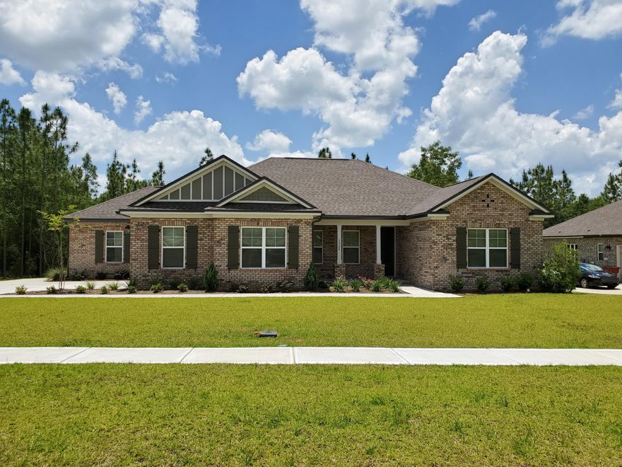 Check out this gorgeous Randy Wise all-brick built home on a large 1/2 acre lot in the coveted Mill Creek Farms Subdivision. Built in 2019, this 2260 sq. ft, 4 bed/2 bath home has a great open living area, flex/office area and formal dining area. The kitchen boasts granite counter tops, stainless-steel appliances, spacious pantry, breakfast bar and plenty of work-space with the kitchen island. This split bedroom plan has an awesome Master Bed/Bath including double vanity, separate 5' tiled shower, garden tub and walk-in closet. A covered back porch, 8' interior doors, recessed lighting, crown molding throughout and an irrigation/sprinkler system are just some of the other great features you won't find in just any home. This home is also an Energy efficient Gulf Power EarthCents Certified. home. And best of all it's located within reasonable driving distance to all area military bases. Don't wait too long to schedule your appointment  schedule it TODAY.