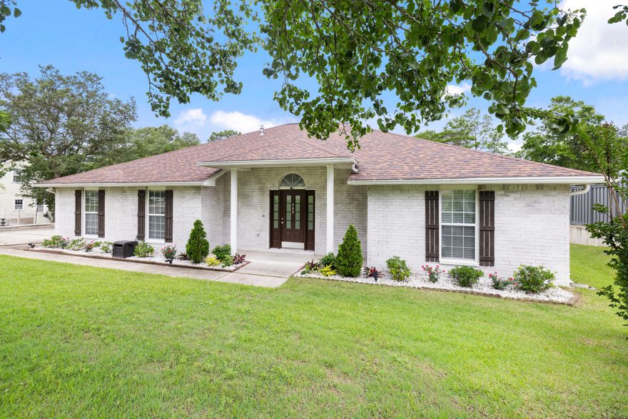 Located in Rocky Bayou Country Club Estates, this beautiful all brick 4 bedroom home offers an inviting blend of comfort, style, and privacy.  Filled with natural light and thoughtfully designed living spaces, the home features an open flow ideal for both everyday living and entertaining.  The kitchen is both functional and attractive, featuring quartz countertops, stainless steel appliances, a gas range, breakfast bar, and dining area, all open to the main living space. Spacious living room features recessed lighting, a corner gas fireplace, and views of the screened Florida room and backyard.  A split bedroom layout provides privacy, with the Master suite tucked away from the additional  bedrooms for added separation and comfort.  Two secondary bedrooms and a full bath are located on the opposite side of the home, while a fourth bedroom near the front offers flexibility for guests, an office, or additional privacy.  Updated flooring, fresh carpet, and neutral finishes create a warm, move-in ready feel throughout.  Enloy quiet mornings or relaxed evenings in the screened Florida room overlooking the spacious backyard and peaceful natural setting.  Major improvements include a 2020 Roof, 2023 HVAC, and 2020 Water Heater.  Conveniently located near schools, shopping, dining, and Rocky Bayou Country Club amenities, this home offers comfort, flexibility, and a location that makes everyday living easy.