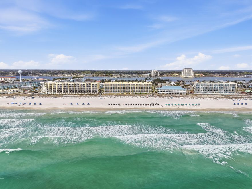 Wake up to panoramic Gulf views and the sound of waves from this beautifully maintained beachfront condo at Pelican Isle. Unit 506 offers 2 bedrooms, 2 baths, and a bonus hallway bunk space--blending relaxed coastal living with strong rental appeal.

Step inside to a bright, open living space designed to showcase the view. Floor-to-ceiling sliding glass doors lead to a private balcony overlooking the emerald waters and pristine shoreline--ideal for morning coffee or unwinding at sunset. The kitchen flows seamlessly into the dining and living areas, creating an easy, inviting space for entertaining or relaxing after a day at the beach. Pelican Isle amenities include direct beach access, a Gulf-front pool and hot tub, fitness center, and covered parking--all just minutes from the dining, shopping, and entertainment of Fort Walton Beach and Destin.
Whether you're looking for a proven investment, a second home, or your own beachfront getaway, Unit 506 delivers the views, location, and lifestyle buyers are searching for--just in time for peak season.