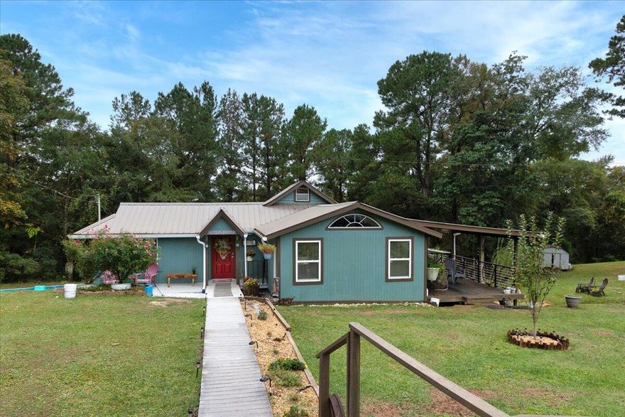 River Life in Paradise! Home has a Crestview address but is in the Mossy Head area. This property has endless Possibilities with room to grow! Escape the hustle and bustle of city life in this lovingly cared for country home, on over 294+ feet of river front property on Shoal River.  The property is high and dry and slopes to the river with three storage buildings on site and a metal carport.  Enjoy peace and tranquility in this 3 bedroom/2 bath home with a loft and there is even a basement or could be a root cellar!  Watch the stars at night from one of your porches listen to the frogs and nature, in the morning wakeup and enjoy a cup of coffee.  Cool off in the river after a day of living and working on the land! So peaceful and quiet among the pines. Make it yours today! Close to military bases and everything the Emerald Coast has to offer! Live off the land and enjoy peace and tranquility!