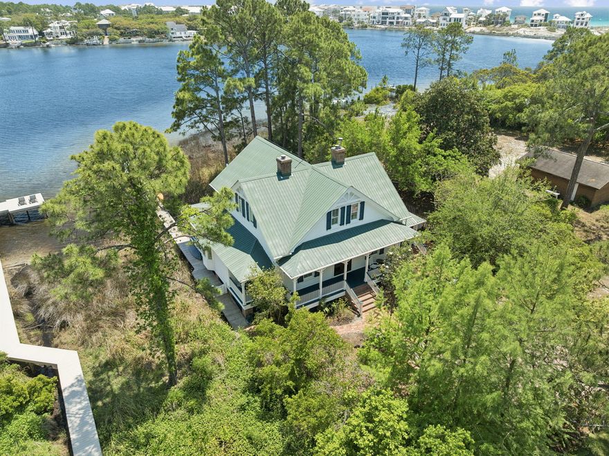 Experience the best of coastal living in this beautifully updated 4 bedroom home, ideally situated on a rare coastal dune lake in Seagrove. It has nonstop views of Eastern Lake with surrounding privacy and an oversized lot.  Kayak or paddle to the beach from your private dock. 
Thoughtfully renovated blends modern upgrades with relaxed coastal charm and move in ready! The home has 4 BR / 4BA with a master on the main and second level. Lots of outdoor living with porches and decks to enjoy the water views from.
This amazing home has 2971 sq ft of living space, 13 ft ceilings, heart of pine floors, multiple fireplaces. **A short walk to the beach
ideal as a primary residence,second home, or investment opportunity.  No HOA and a EV CHARGER as well as an upstairs WETBAR