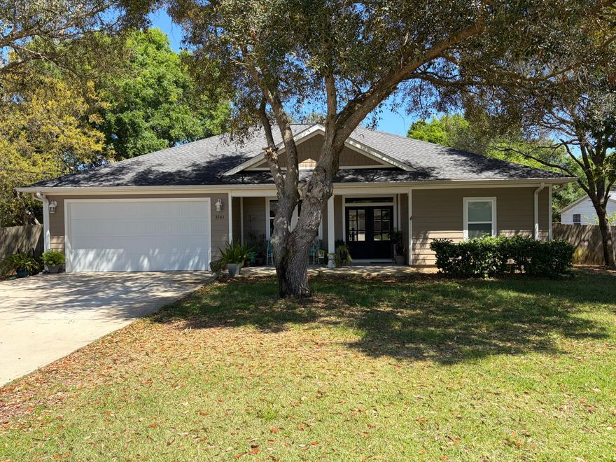 Welcome home to this stunning 2019 ranch-style gem featuring hardwood floors throughout, an open-concept kitchen and living area with quartz countertops, a large island, and abundant cabinet space -- perfect for entertaining. The primary suite impresses with a tray ceiling and a spa-like walk-in shower. Step outside through the French back doors to a large lanai with ceiling fan flowing onto a 15x12 concrete patio, all within a spacious fenced backyard with a 7x7 shed. With a 2-car garage, 5 ceiling fans, and fresh 2019 finishes throughout -- this one checks every box. Don't miss out!