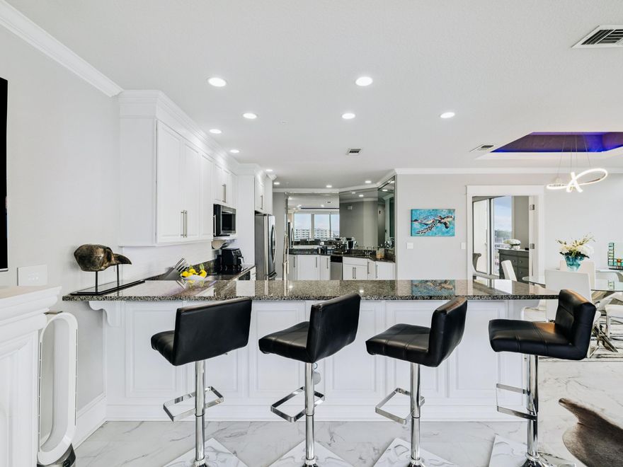 Welcome to Harbor Place 401 -- a boutique five-story condominium offering just 12 exclusive residences along the iconic Destin Harbor, with views extending toward the Gulf of Mexico and beyond. This two-bedroom, two-bath corner residence spans approximately 1,315 square feet and is filled with natural light thanks to its wraparound, floor-to-ceiling windows. The spacious layout offers an inviting coastal retreat ideal for both full-time living and a second home. The kitchen is equipped with Samsung appliances, an LG electric range and cooktop, GE Adora dishwasher, and Whirlpool Gold icemaker. Smart home enhancements include powered blinds in the primary bedroom, living areas, and guest room. The primary suite also features a lift TV and a mechanical bed for added comfort and convenience. Additional notable updates include an HVAC system installed in 2021 with an iWave air purifier, a water heater installed in 2023, and tinted windows and doors throughout.

Harbor Place is a rental-restricted community, creating a quieter, more residential atmosphere. Residents enjoy a private dock with harbor access, a heated swimming pool, a ground-level fitness center, a rooftop common-area balcony overlooking the water, and a convenient community ice maker--perfect for packing coolers before beach or boating days. This condo includes dedicated private storage on the basement level and two unassigned parking spaces.

Recent building improvements include a new seawall with expanded land usage and walkway, an upgraded water pump for stabilized pressure, improvements to the ground-level gym area, and strong reserve funding with no current assessments identified.

Located in the heart of the Destin Harbor district, the property offers close proximity to waterfront dining, entertainment, and boating, all while maintaining the privacy and exclusivity of a low-density building. It is a rare opportunity to own in one of Destin Harbor's most intimate and well-maintained condominium communities.