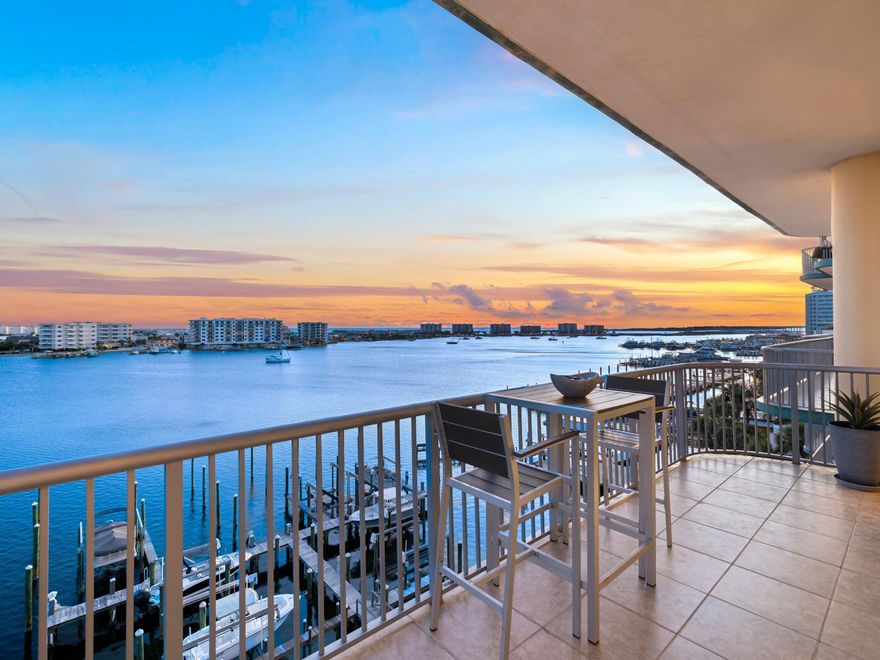 Welcome to Harbor Place 401 -- a rare opportunity to own within one of Destin Harbor's most intimate and owner-oriented waterfront communities. Tucked within a boutique five-story condominium comprised of just 12 residences, this corner unit offers a quieter, more residential approach to harbor-front living.

With rental restrictions prohibiting short-term rentals, Harbor Place is uniquely suited for buyers seeking privacy, low density, and a more relaxed ownership experience with less transient traffic and vacation turnover. Unlike many of the larger resort-style condominium communities along the harbor, Harbor Place offers a true residential atmosphere in the heart of Destin's waterfront district. Inside, the approximately 1,315-square-foot residence is filled with natural light from wraparound floor-to-ceiling windows that frame beautiful harbor views and glimpses toward the Gulf. The two-bedroom, two-bath layout offers an inviting coastal retreat equally suited for full-time living or a second home.

The kitchen is equipped with Samsung appliances, an LG electric range and cooktop, GE Adora dishwasher, and Whirlpool Gold icemaker. Additional features include powered blinds in the living areas and bedrooms, a lift TV in the primary suite, and a mechanical bed for added comfort and convenience.

Conveniently located along the harbor, Harbor Place is within walking distance to several of Destin's favorite waterfront dining destinations, including Marina Cafe, Boshamps, and Harbor Docks. Owners may also enjoy the convenience of harbor water taxi service with pick-up available directly from the community dock.

Residents enjoy a swimming pool, fitness center, rooftop observation deck overlooking the harbor, dedicated owner storage, and a community dock with direct harbor access--ideal for waterfront enjoyment. Additional community features include a gated building entrance, private parking with 24 trellised parking spaces shared among only 12 residences, a paddleboard and kayak storage hut along the shoreline, and an approximately 8' x 10' secure storage space located in the building's basement level.

Harbor Place 401 is for the buyer seeking harbor living without the chaos of a vacation-rental environment -- a hidden residential gem offering privacy, waterfront beauty, and a true sense of ownership along the Destin Harbor.