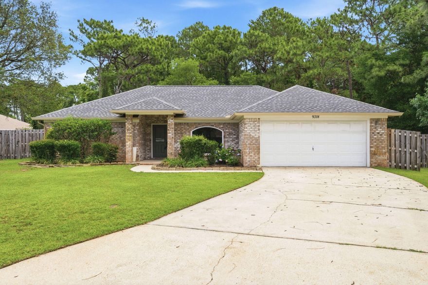 Welcome to this beautiful, move-in-ready, 3 bedroom, 2 bathroom, brick home in Navarre. Nestled on a cul de sac in the Biscayne Pointe neighborhood - just minutes away from the sugary white sands of Navarre Beach, grocery stores, and local shopping and dining spots. Excellent location for Hurlburt Field commuters! Biscayne Pointe includes deeded access to the Santa Rosa Sound with a community Beach walk and a covered dock. Excellent curb appeal with beautiful landscaping. Inside, this home is freshly painted and offers hardwood flooring throughout - with a split floorplan for ultimate privacy and functionality. The open concept Main living space features a front dining or office space with a large arched window with the most amazing view of the various colored hydrangeas in the front landscaping. The kitchen has wooden cabinetry with under cabinet lighting, granite countertops, stainless appliances, and a breakfast bar that flows into the living room - perfect for casual dining and entertaining. There is also an additional dining or office space at the back of the house - framed by windows all around to allow natural light to flow throughout. The primary suite offers a tray ceiling and an ensuite bathroom with double oversized  closets, a double vanity, and a walk-in shower. The large fenced-in backyard is ready for outdoor entertaining and al fresco dining! Schedule your showing today and call it your home on the Emerald Coast!