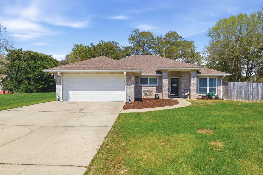 Welcome to Robledal Estates, one of West Navarre's most beloved and charming neighborhoods. Known for its winding, curvy roads, towering mature oak trees, and peaceful atmosphere, this community is full of life. Residents enjoy evening strolls, bike rides, and friendly dog walks beneath the beautiful oak canopy. Keep an eye out for the neighborhood's famous albino squirrels, a rare and fun sight that locals love to spot!

Located just 15 minutes from the beautiful white sands of Navarre Beach, this home also offers easy access to the sidewalks just outside the neighborhood that lead down East Bay Boulevard, perfect for walking, biking, or enjoying the coastal scenery. Situated on a large fenced corner lot at the entrance of a quiet cul-de-sac, this beautifully maintained all-brick home offers both privacy and space. The oversized yard provides plenty of room for your recreational toys--whether it's an RV, camper, or boat--and the deep driveway offers generous parking for guests and family.

Inside, the home features three spacious bedrooms with a desirable split floor plan, creating added privacy for the primary suite. The living spaces are warm and inviting, offering two dining areas perfect for entertaining or everyday family meals.

The oversized kitchen is truly the heart of the home, complete with a charming coffee bar area and a kitchen sink window overlooking the beautiful front yard. Elegant plantation shutters add timeless character and natural light throughout the home. Bedrooms feature carpet for comfort, while the main living areas are designed for easy maintenance and everyday living.

Step outside to enjoy the large backyard shaded by mature oak trees, creating a peaceful outdoor retreat. A storage shed conveys as-is, offering additional space for tools or lawn equipment.

Major updates provide added peace of mind, including a roof installed in 2021, along with newer HVAC and water heater Within the last 4 to 6 years, which may help contribute to lower insurance costs. The home also includes a double-car garage for added storage and convenience.

One of the many unique perks of Robledal Estates is the optional neighborhood water access through Crab Inc. Property owners have the opportunity to pay a one-time membership fee, which allows access to launch your boat within the neighborhood for a small usage fee.

Best of all, there are no HOA dues required to live in Robledal Estates, giving homeowners freedom while still enjoying the charm and character of this highly desirable community.

Homes in Robledal Estates are cherished for their mature landscaping, quiet streets, and unbeatable West Navarre location. This meticulously cared-for property offers the perfect opportunity to enjoy the lifestyle that makes this neighborhood such a hidden gem along the Emerald Coast.

Come see why so many people love calling Robledal Estates home.