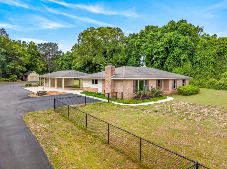 $23,000 Buyer costs paid by Seller. Your own private retreat-five acres just minutes from town, where nature and comfort meet in perfect balance. Beautifully renovated 3-bedroom, 2-bath home (2014 updated) offers modern living surrounded by the charm of country life. Wood FPL. Master BR has 2 closets, one is a walk-in. New HVAC system 4/22/26. Property is a dream for hobbyists, adventurers, and anyone needing space: an attached 3-car carport, expansive 24x48 RV garage, detached 1-car garage, a shop, tool shed, and a greenhouse for your gardening passions. Wander through the land and discover flourishing blueberry bushes and a serene wooded backdrop with winding trails-perfect for morning walks, quiet reflection, or weekend exploration. R1 Zoning. See Features Sheet in the Document Section.