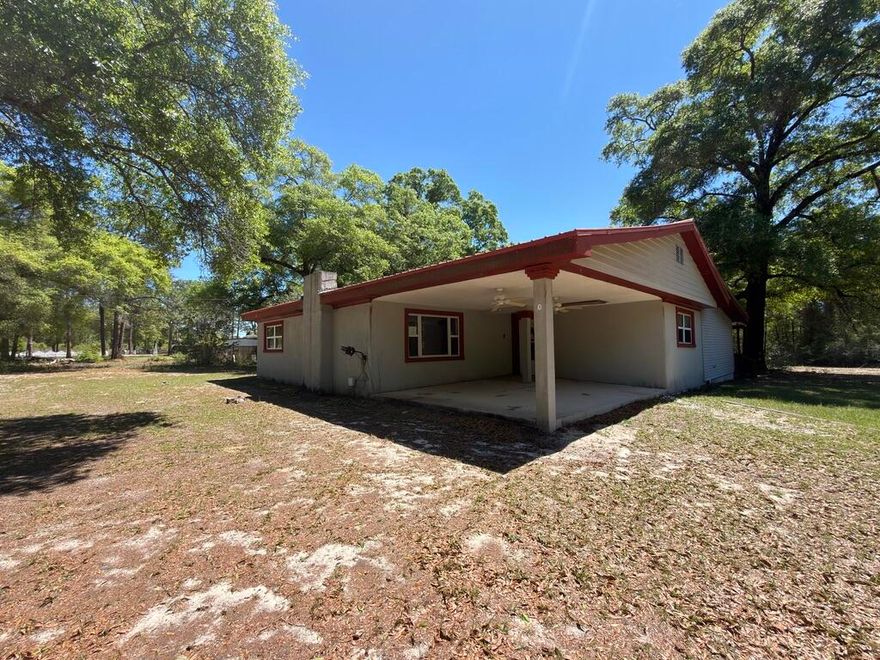 Country living awaits at this East Defuniak REO opportunity. Built in 1962, this large home rests on approx 2.5 acres of flat land and comes with stucco siding, metal roof, covered back porch and tons of potential. Inside you will find split bedroom design with a large living room with fireplace, separate dining area, large kitchen and equally large pantry/laundry area. Unique to the area, there is also a nearly 300sf cement walled basement. This home needs repairs and will not qualify for most financing. Several areas of the home need roof/ceiling repairs, flooring etc. Please keep this in mind when looking for potential financing options. There are certainly financing options available for this home. Call today!