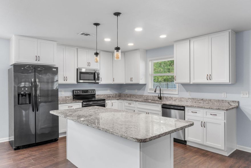 Set on a beautifully landscaped homesite, this thoughtfully updated Crestview property offers space, privacy, and exceptional value. This listing includes the home and workshop only. For those interested in the full one-acre offering, please refer to MLS ID 994934.

Located south of Highway 90 and directly across from Blackwater Golf Club, the property enjoys a peaceful setting while remaining conveniently accessible to surrounding areas. Being situated on county land rather than within city limits may offer lower property taxes. The grounds are enhanced by mature fruit and nut trees, including pear, pecan, and walnut.

With an effective build year of 2000 and over 2,000 square feet, the home was fully renovated inside in 2018. Updates include modern kitchen cabinetry, granite countertops stainless steel appliances, spray foam insulation, and an open-concept layout that creates a bright, functional living space.

In 2024, the exterior received a fresh transformation with new paint, limewashed brick, and updated trim, contributing to strong curb appeal. Additional improvements include a new fence, a courtyard area, and a whole-home water filtration system. The Aquasana Rhino system provides filtration throughout the home with a salt-free conditioning system.

The fenced backyard offers ample room for outdoor use and includes a utility shop that has been recently painted, suitable for storage, hobbies, or workshop use. The property is also equipped with a full ADT / Alarm.com security system installed in 2019.

Positioned approximately 15 minutes from Duke Field and 30 minutes from Eglin Air Force Base, this property provides a balance of privacy and accessibility.

Schedule your private showing today.