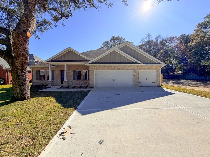 ***BUILDER MEMORIAL DAY INCENTIVE!!!*** This stunning brand-new Craftsman-style residence in the heart of Niceville offers a rare combination of modern luxury and turn-key convenience. Boasting five spacious bedrooms and three full bathrooms across a thoughtfully designed 2,656-square-foot layout, this home is engineered for both sophisticated entertaining and comfortable daily living. The heart of the home is a chef-inspired kitchen featuring premium quartz countertops, a professional gas range, custom soft-close cabinetry, and a deep farmhouse sink, all centered around a functional island and a massive walk-in pantry. High-end luxury vinyl plank flooring flows seamlessly through the main living areas, accented by elegant crown molding and soaring vaulted and tray ceilings that enhance the home's open, airy feel. The split-bedroom floor plan ensures maximum privacy for the primary suite, which serves as a true retreat with its spa-like garden tub and dual-vanity bath. Efficiency and safety are paramount, with the inclusion of a tankless gas water heater, natural gas heating, hurricane-rated shutters, and a full sprinkler system. Unlike most new construction, this home is truly move-in ready, featuring a fully installed privacy fence, custom window blinds, and a stainless steel refrigerator already in place. Outside, the oversized three-car garage provides ample space for vehicles, a boat, or a workshop, while the level backyard offers a secure oasis for relaxation. Situated in the top-rated Plew, Ruckel, and Niceville High school districts, this 2025-built home is just minutes from Eglin AFB and the white-sand beaches of the Emerald Coast.