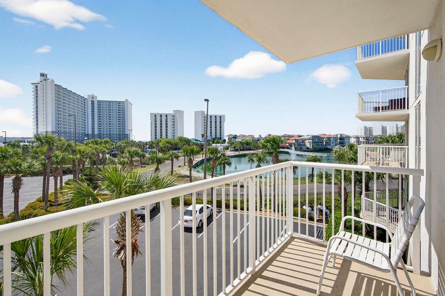 Let it be SUNSHINE - PRICED TO SELL! This beautifully maintained 3-bedroom, 3-bath condo is conveniently located on the second floor--no waiting for elevators. The highly desirable floor plan features wraparound balconies and additional windows, filling the space with natural light. The third bedroom offers its own private ensuite with a mini kitchen--perfect for guests or rental flexibility. Two bedrooms and the living room provide direct access to the spacious balcony, ideal for enjoying the coastal breeze. Recent updates include flooring, drapes, and a renovated primary bathroom shower, all completed just two years ago. The Terrace is located in one of the most popular vacation complexes on the Emerald Coast. Terrace at Pelican has their own pool and grill area, and owners and guests at Terrace have unlimited use to all of Pelican Beach amenities including direct beach access, multiple beachfront pools (including indoor/outdoor options), hot tubs, indoor sauna & steam room, a fitness center, tennis courts, pickleball, on-site café and tiki bar, game room and security gate This condo makes it a great investment, second home or primary residence being in the heart of Destin