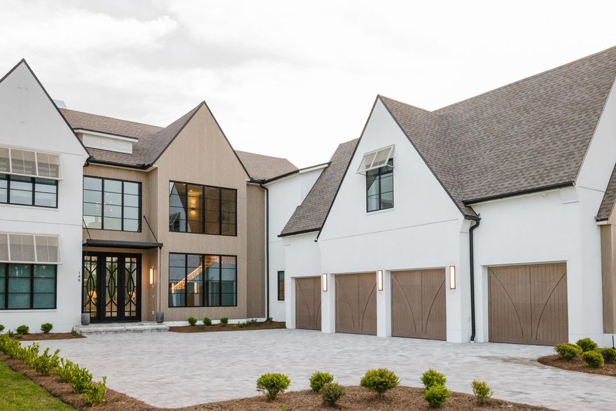 Set within the exclusive gates of Watersound Camp Creek, this extraordinary 7,272-square-foot estate offers seven bedrooms, seven full bathrooms, and three half bathrooms. Ideally positioned as the closest current home to the club amenities, yet uniquely buffered from the noise of Highway 98, this home delivers a rare balance of convenience and serenity.
Situated on one of the most private homesites in Camp Creek, 186 Windsong Drive enjoys unobstructed surroundings with no future construction behind or across the street. The striking exterior showcases architectural excellence with expansive storefront glass, custom garage doors, and refined details like half-round gutters and white oak-inspired fiber cement siding. A four-car garage features epoxy flooring, EV chargers, and advanced WiFi- enabled side-mount doors.
Designed for seamless indoor-outdoor living, the home opens through 12-foot disappearing sliding doors to a resort-style outdoor retreat. A heated pool with a vanishing-edge spa and tanning shelf anchors the space, complemented by a synthetic turf recreation area, a fully equipped outdoor kitchen with gas and ceramic grills, weather-resistant cabinetry, and a dedicated pool bath. Thoughtful touches like integrated holiday lighting outlets and a concrete retaining wall add both beauty and durability.
Inside, the home is a masterclass in craftsmanship and technology. Soaring ceilings reach 14 feet with a dramatic 22-foot vault, accented by coffered white oak detailing and wide-plank wood flooring throughout. A floating staircase with custom iron railing, Venetian plaster finishes, remote operated phantom screen, and linear fireplaces in the living spaces and primary suite create a warm yet contemporary aesthetic.
The chef's kitchen is equipped with top-tier appliances including Wolf double ovens, a six-burner gas cooktop with griddle, dual dishwashers, multiple refrigeration units, a wine refrigerator, and a fully appointed scullery with hidden laundry access. Smart living is effortless with an elevator, whole-home Lutron lighting system, Sonos audio, and central vacuum.
The primary suite is a private sanctuary featuring a steam shower, built-in sauna, soaking tub, coffee bar, dual vanities and water closets, separate custom closets, private laundry, and automated drapery. Upstairs, a spacious bonus lounge with a 98-inch TV, wet bar, beverage cooler, and ice maker opens to a deep rear porch with forested views toward the clubhouse. The dedicated workout or flex room includes a private full bathroom and is prewired for a golf simulator.
Each of the additional guest rooms offers en suite baths, walk-in closets, and spacious vanities, ensuring comfort and privacy for extended family and guests. Three separate laundry areas, multiple HVAC systems, whole-home water filtration, foam insulation, and generator readiness provide unmatched efficiency and peace of mind.
186 Windsong Drive offers a meticulously curated lifestyle, where luxury, privacy, and cutting-edge design converge in one of Florida's most coveted coastal communities. Enhancing the value even further, owners in Camp Creek enjoy a coveted lifestyle and golf membership initiation to the Watersound Club, granting immediate access to world-class golf, beach club, dining, and resort-style amenities.