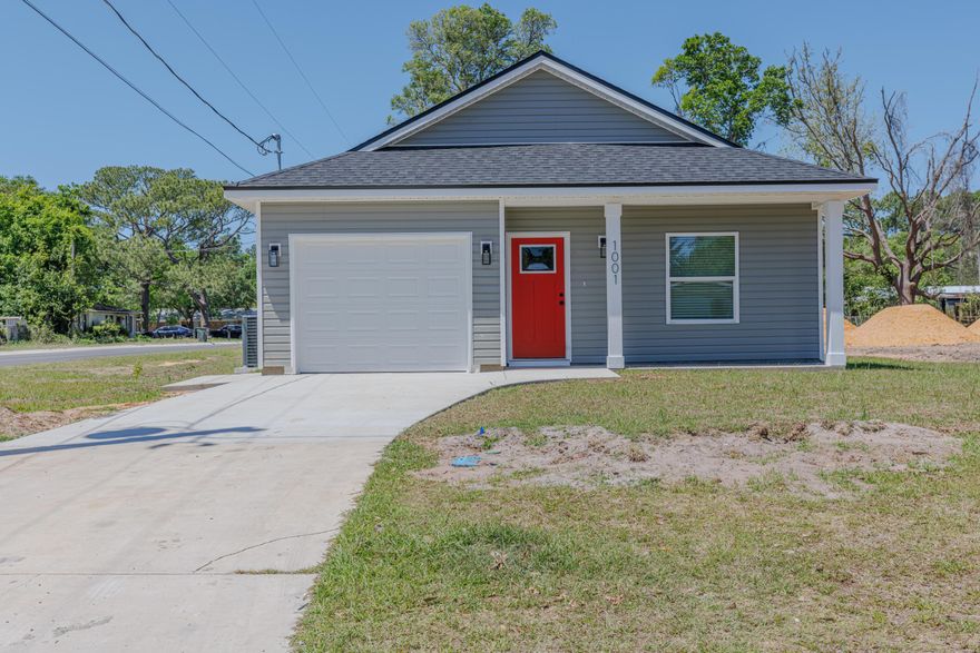Beautifully designed new construction home featuring 3 bedrooms, 2 baths, and a 1-car garage, conveniently located just minutes from the Navy base, with easy access to shopping, dining, and entertainment--ideal for those seeking a short commute and flexible lifestyle. This thoughtfully planned home offers a spacious primary suite with an elegant tray ceiling and a spa-inspired ensuite bath complete with a double vanity with quartz countertops and walk-in closet. The open-concept kitchen is a true centerpiece, featuring a center island, Whirlpool stainless steel appliances, shaker-style soft-close cabinetry, and ample quartz countertop space-- perfect for everyday living and entertaining. Additional highlights include non-impact windows with fabric hurricane protection and placement  in an X flood zone--no flood insurance required. Convenient location, quality new construction, secure this home early and make it yours!