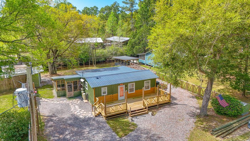 Fully renovated waterfront country retreat ideal for a homestead, or perfect weekend getaways!  This charming 2-bedroom, 1-bath home sits on a peaceful canal with direct access--just minutes by boat to the Intracoastal Waterway and Choctawhatchee Bay. Set on .22 acres, it's perfect for nature lovers, boating, and outdoor enthusiasts. Inside features include new LVP flooring, soft-close, custom cabinets and drawers, custom countertops, updated fixtures, innovative pull-out shelving, and a cozy open-concept layout filled with natural light. Enjoy great decks and outdoor sitting areas for relaxing by the water, plus major updates including a new roof, HVAC, and hot water heater.