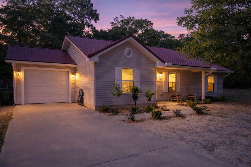 Welcome to 65 Sidney Avenue in DeFuniak Springs--a charming Craftsman-style home that blends comfort, durability, and everyday functionality. Built in 2007 and thoughtfully maintained, this 3-bedroom, 2-bath residence offers approximately 1,270 square feet of well-designed living space on a spacious 0.31-acre lot.

Step inside to find a bright, inviting interior featuring a vaulted ceiling in the main living area, creating an open and airy feel. The layout flows seamlessly from the living room into the kitchen and dining space, making it ideal for both daily living and entertaining. The home is equipped with modern conveniences including a full appliance package--refrigerator, stove/oven (dual fuel), dishwasher, microwave, washer, and dryer--along with recessed lighting and ceiling fans throughout.

The primary suite offers a private retreat with a walk-in closet and en-suite bath, while two additional bedrooms provide flexibility for guests, family, or a home office. Outside, enjoy a fully fenced yard with privacy fencing, perfect for pets, gatherings, or simply relaxing in your own space. Additional features include an attached garage, yard building for extra storage, and paved road access.

A durable metal roof adds long-term value and peace of mind, while the home's central electric HVAC system ensures efficient year-round comfort. Conveniently located near schools, shopping, and dining in the heart of DeFuniak Springs, this property offers both tranquility and accessibility.

Meticulously cared for and move-in ready, this home is a rare find--perfect for anyone seeking a well-built property with lasting charm and modern convenience.