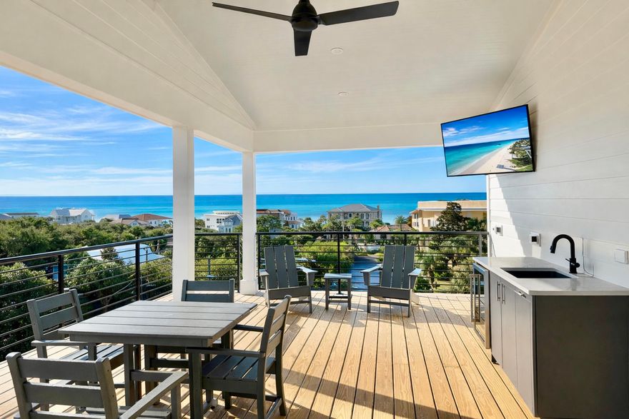 Brand-new and just finished, this four-story beach retreat sits south of Scenic Highway 30A on Mary Street, less than a 5-minute walk to the white sand beaches and emerald green waters of Blue Mountain Beach, Fla. Designed as a true rental powerhouse with projections around $235,000, this 5BR/5BA+2 half bath home is built for fun, comfort, and income. The first level lives like a poolside cabana, with a mini kitchen, half bath, and a full wall of sliders that open straight out to the private pool and sun deck—perfect for entertaining. Upstairs, the main living floor offers a large open kitchen, dining, and living area with Thermador appliances, a gas range, a sweeping island, and a walk-in pantry, ideal for big groups to gather. The whole second floor is dedicated to this open