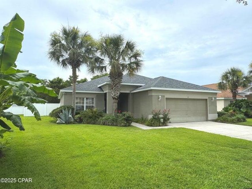 GOLF CART TO THE BEACH! Choose either furnished for a perfect second-home or unfurnished as a primary residence; at a discounted price. This home at 219 Oxford is turn-key and well maintained in a golf cart friendly neighborhood that is minutes to the beach. The large lot sits next to a natural preserve with a small lake. Palmetto Trace is ideal for a primary residence as a sweet family neighborhood with two pools, shaded gazebo with tables, scenic lakes, sidewalks, and tree-lined streets. The backyard has a new vinyl fence and was recently sodded. Enter through a welcoming foyer to an office or flex space through double doors to your left. The kitchen is spacious, open to the rest of the house, and features a chandeliered dining area. You will find custom features like a beautiful tray ceiling in the living room, plank flooring, kitchen sky light, wood kitchen cabinetry, built-in bar cabinet with cooler, security system, deluxe dimmable lighting, and surround sound throughout. The owner's suite has its own bathroom with a dual head steam shower, soaking tub, dual vanity, private toity room, and walk-in closet. The split floor plan places the second and third bedrooms at the front of the house with a full guest bathroom to share. The laundry room is complete with a full-size washer+dryer and leads to the oversized 2-car garage with storage shelving. There is a large, windowed sunroom off the living room, with portable ac, leading to an extended open back patio. The AC is brand new, exterior recently painted, roof was replaced in 2019 and there are easy to install hurricane shutters. Convenient to exciting Pier Park entertainment center, iconic 30A shoppes, highway for road trippers, and Beaches Int'l Airport. If you would prefer to purchase unfurnished, owners will clear it out. Reach out today for info and/or a tour to take a step closer to the coastal lifestyle you've always wanted!