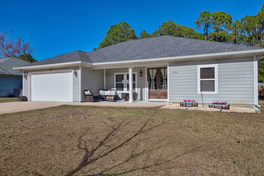 This beautifully maintained 4-bedroom home delivers an impressive open layout with soaring ceilings and natural light that instantly elevates the space. The modern kitchen features a large island, pantry, and crisp white cabinetry. The master suite stands out with a tray ceiling, spacious walk-in closet, and double vanities. Recent upgrades include smart-home features and updated lighting. Enjoy covered front and back porches and a deep backyard on a quiet Navarre street close to schools, shopping, and Hurlburt.