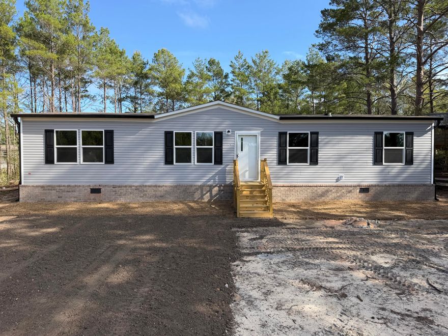 Professional photos coming soon on this BRAND NEW construction home just completed at an accessible price point in DeFuniak Springs. Friendly floorplan allows for comfort and functionality. Featuring gutters, true brick skirting, and pilled pavement driveway, this home is upgraded from a lot model. Room sizes for allow for versatility for each family member to have their own space, for hobbies, or guests. Home is situated on a lot that is manageable, with NO HOA.