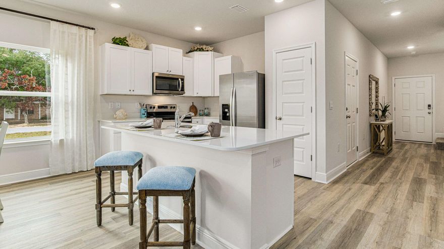 Welcome to The Enclave at Midtown!

The Palm Interior Unit is a 2-story townhome that boasts 3 bedrooms, 2.5 baths with an open design that is perfect for entertaining. The kitchen is presented with quartz countertops, a large island bar, pantry and all stainless-steel appliances offering style and functionality. Bedroom 1 is located on the second floor as a private retreat with a spacious walk-in closet and a beautiful adjoining bath. Interior features also include EVP flooring with frieze carpet in the bedrooms. ALL LISTING pictures, colors, features, and size may vary. Square footages are approximate.