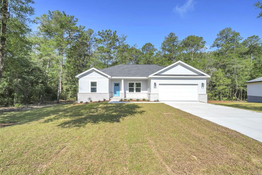 COMPLETION APRIL 30, 2026!! BRAND NEW CONSTRUCTION! IDEAL LOCATION! This new home is perfectly situated in the community of Hunter's Ridge located directly behind Walton High School with close proximity to city parks and Downtown Defuniak Springs.  Hunter's Ridge boasts; underground utilities, countless trees, and public water/sewer.  Enjoy the comfort of the split bedroom floor plan. Interior features include; LVP (luxury vinyl plank) flooring in the main living areas, tiled bathroom floors, stainless appliances, solid surface countertops, high-grade mill work, custom shelving in closets/pantry, and a plethora of recessed, can lighting/designer light fixtures.  Exterior features; architectural brick and fiber cement siding, wooden tongue and groove stained entry ceiling at front porch, two-car garage, and 3 dimensional roof shingles.  Make 183 Hunters Ridge Drive your brand new Florida address!!