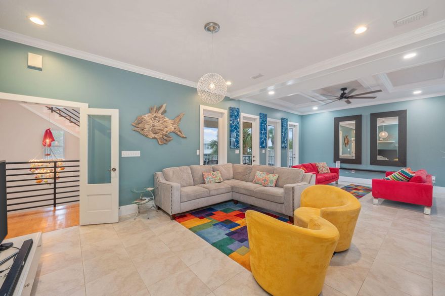 Located in the gated community of Maravilla & tucked away in a quiet cul-de-sac you'll find this spacious beach retreat. With Deeded Beach access, this is an unbeatable location. Enter into the foyer and you're greeted with a grand staircase that is one of the standout architectural features of the home. Inside you'll find a spacious main living area that includes multiple seating areas, a chef's dream kitchen and dining area large enough for almost any gathering. As your eye begins to catch subtle design details, you'll start to feel just how special & thoughtfully designed this home is. Other features include deep, shaded porches & 4 bedrooms with ensuite baths, with 1 of the bedrooms being a 465 sq.ft. bunkroom that is large enough to be its own separate living area.  Community amenities include private pool, gated access, over 500 feet of deeded beach access, tennis, pickleball, and pool/clubhouse. Although it would make an excellent rental property, this custom home has never been on a rental program and the pride of ownership shows as it is in immaculate condition!
