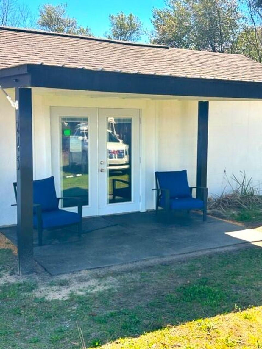 Located 5/10th of a mile from Downtown DeFuniak Springs, along a shaded sidewalk down Live Oak Avenue, you will find this small but quaint office building. Great opportunity for a coffee shop, barber shop, office, studio or retail store. Just across the tracks are USPS, DFS City Police Dept. and DFS City Hall. The block building is situated along the east side of a double lot, so there's room to grow. The property is currently used as a Martial Art Studio, so if that's your interest; it's turnkey ready.